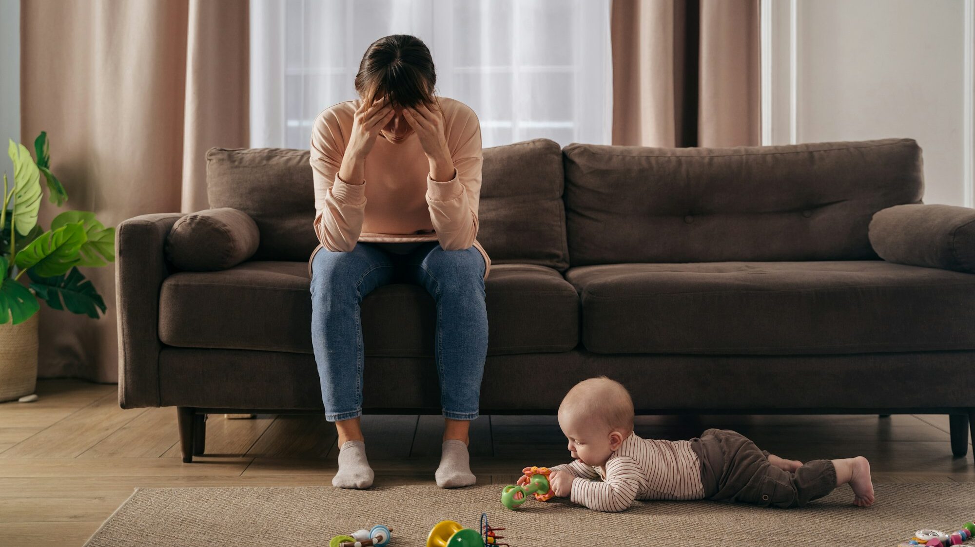 Desperate mother tired from motherhood and suffering from depression
